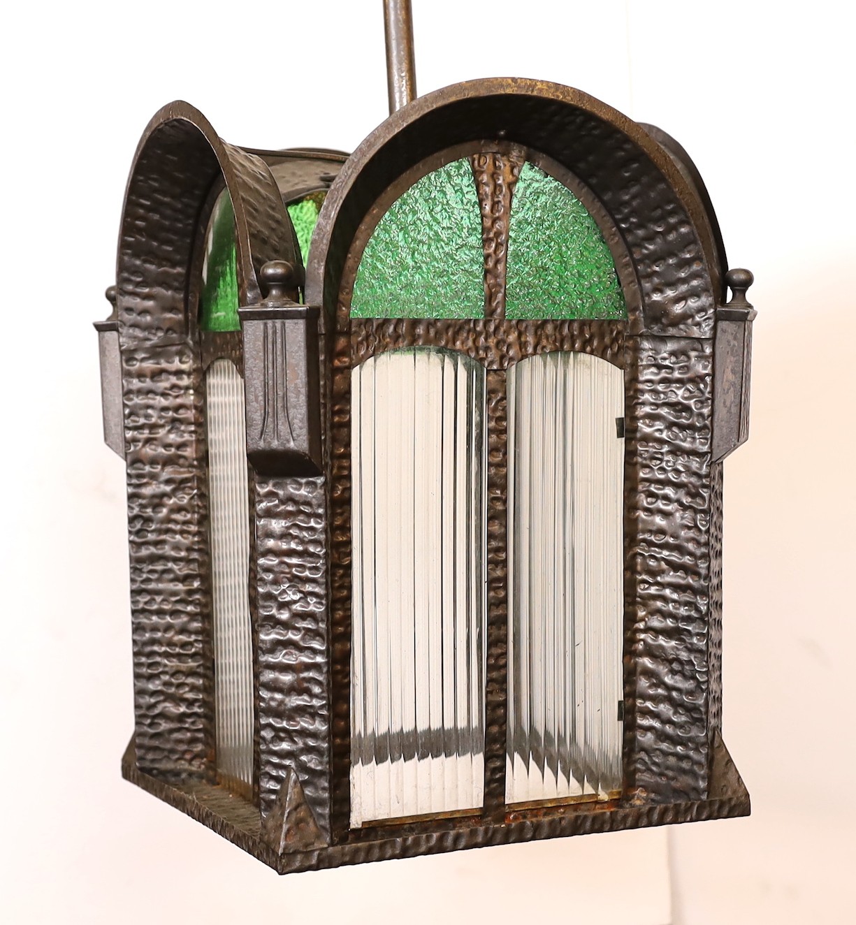 A 1930s Swiss pressed iron, rippled and stained glass hall lantern, height 80cm. width 26cm